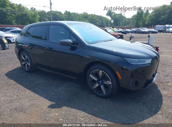 WB523CF05RCR54498 2024 BMW IX Черный Передняя правая четверть
