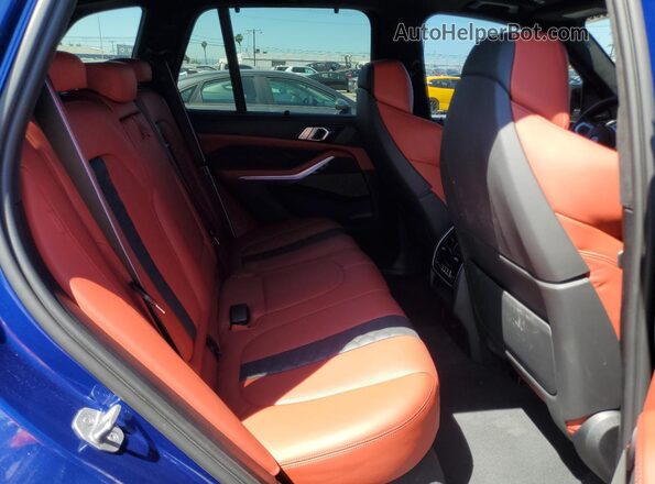 5YMJU0C05N9M64142 2022 BMW X5 Blue Rear interior view