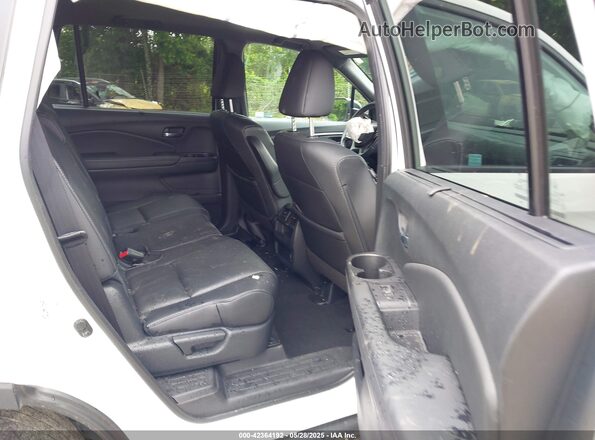 5FNYF7H58MB015881 2021 HONDA PASSPORT White VIN sticker view