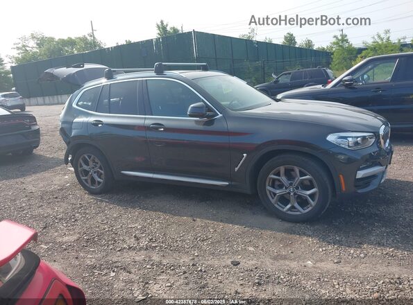 5UXTY5C07M9E96142 2021 BMW X3 Black Vista interior trasera
