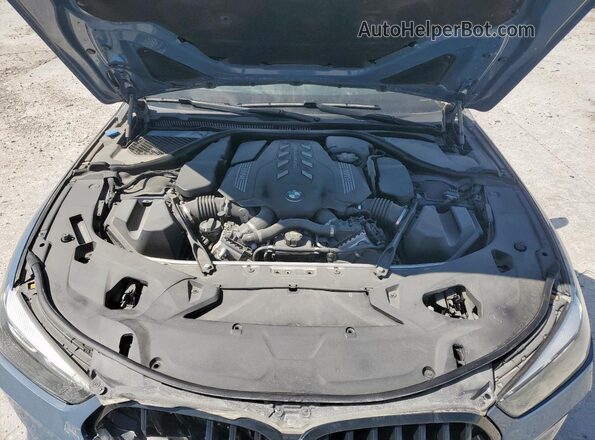 WBAGV8C06NCH98097 2022 BMW M8 Blue Vista interior trasera
