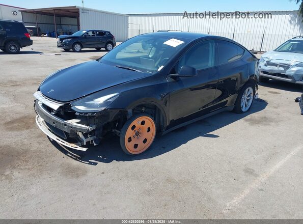7SAYGAEE6PF904152 2023 TESLA MODEL Y Black Vista tres cuartos delantera izquierda