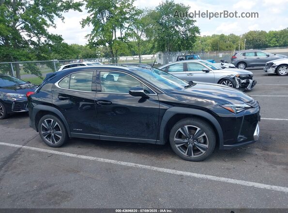 JTHP9JBH2M2052297 2021 LEXUS UX Black Vista interior trasera