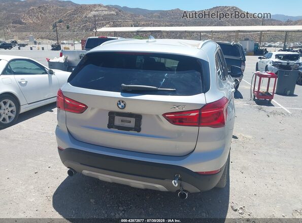 WBXHT3C37H5F87304 2017 BMW X1 Серебряный Задняя правая четверть