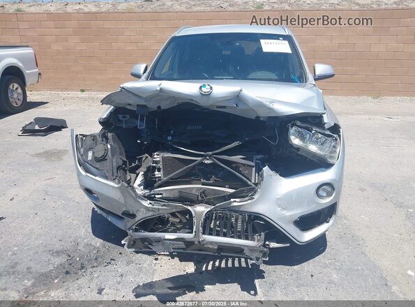 WBXHT3C37H5F87304 2017 BMW X1 Серебряный Вид задней части салона