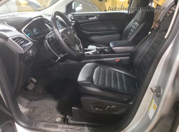2FMPK4J88JBB53774 2018 FORD EDGE Серебряный Вид салона спереди