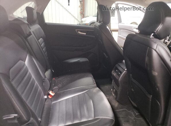 2FMPK4J88JBB53774 2018 FORD EDGE Серебряный Вид задней части салона