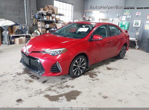 2T1BURHE0JC086063 2018 TOYOTA LL Red წინა მარცხენა ხედი სამი მეოთხედიდან