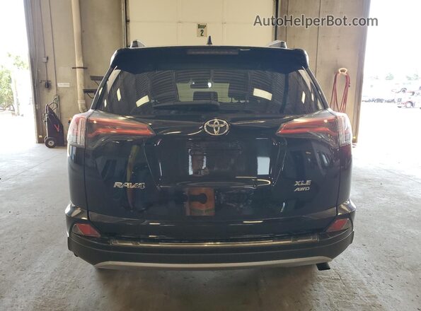 2T3RFREVXJW736469 2018 TOYOTA RAV4 Черный Вид сзади