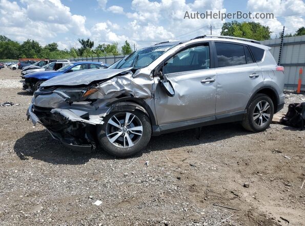 2T3WFREV6JW407299 2018 TOYOTA RAV4 Silver Przód lewy