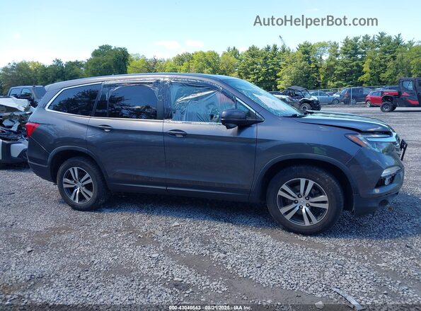 5FNYF6H66JB018521 2018 HONDA PILOT Gray Widok wnętrza z tyłu