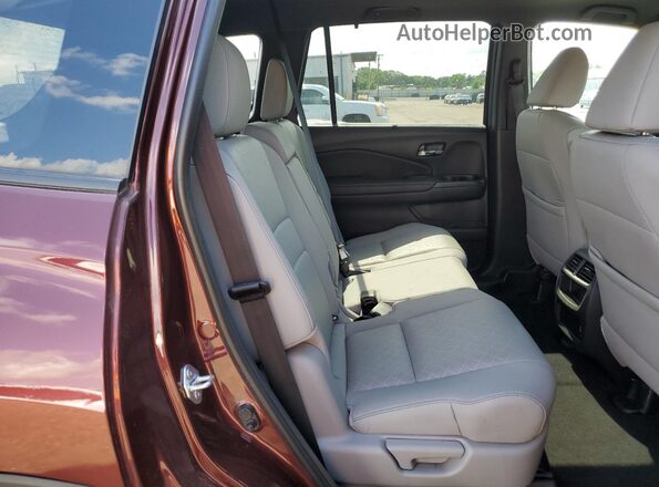 5FNYF8H56MB038839 2021 HONDA PASSPORT Burgundy Rear interior view
