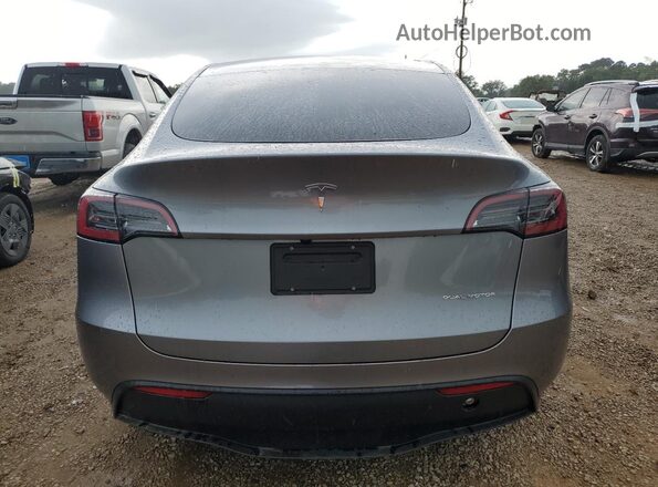 7SAYGAEEXSF303786 2025 TESLA MODEL Silver უკანა ხედი