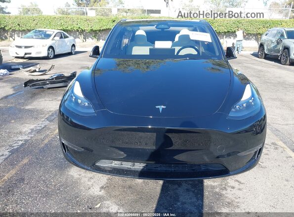 7SAYGDED3SF231189 2025 TESLA MODEL Y Black Սալոնի հետևի տեսք