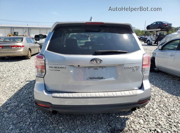 JF2SJGECXJH411587 2018 SUBARU FORESTER2. Gray Rear view