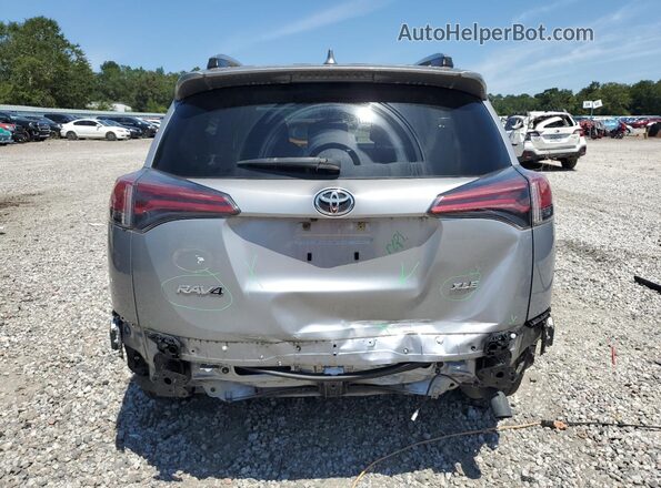 JTMWFREV9JD121881 2018 TOYOTA RAV4 Silver Rear view