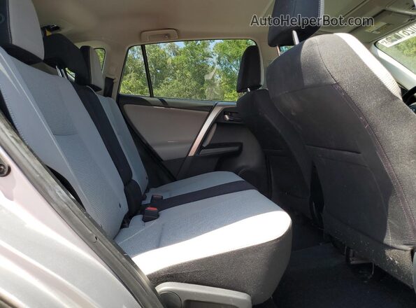 JTMWFREV9JD121881 2018 TOYOTA RAV4 Silver Rear interior view