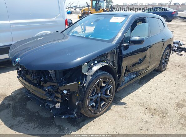 WB523CF02RCN52082 2024 BMW IX Black Vista tres cuartos delantera izquierda