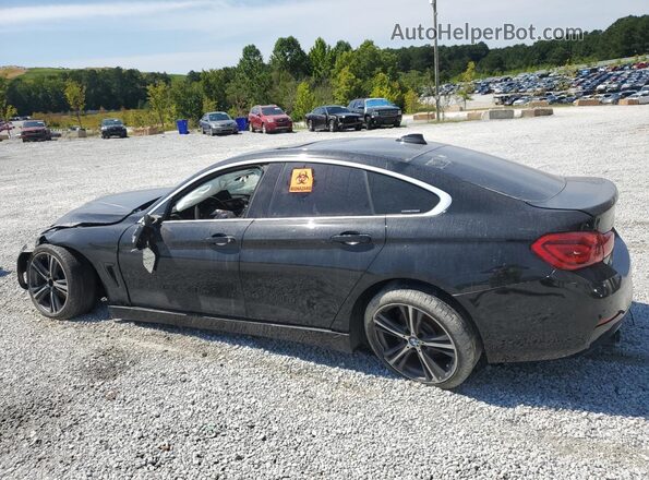 WBA4J1C52JBG79982 2018 BMW OTHER Black Rear left