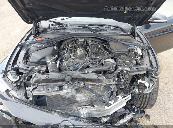 WBA4J5C58JBF07317 2018 BMW OTHER Black Rear view