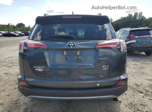 2T3RFREV4JW849611 2018 TOYOTA RAV4 Gray Vista trasera