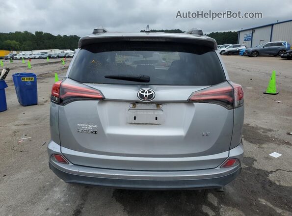 2T3ZFREV7HW360257 2017 TOYOTA LE Серебряный Вид сзади