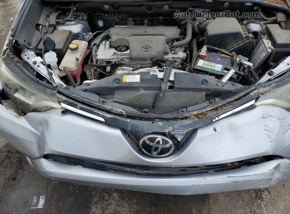 2T3ZFREV7HW360257 2017 TOYOTA LE Серебряный Вид задней части салона