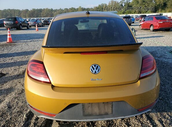 3VWS17AT1HM624757 2017 VOLKSWAGEN BEETLE Gold Rear view