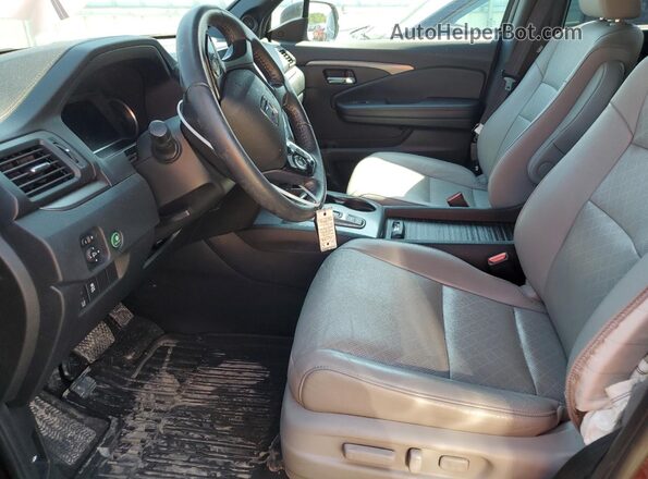 5FNYF8H57MB041958 2021 HONDA PASSPORT Burgundy Vista interior delantera