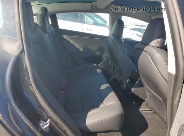 5YJ3E1EA7SF890930 2025 TESLA MODEL Gray Սալոնի հետևի տեսք