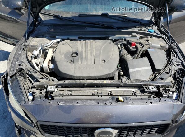 7JRL12TL4RG290440 2024 VOLVO S60 Charcoal Vista interior trasera