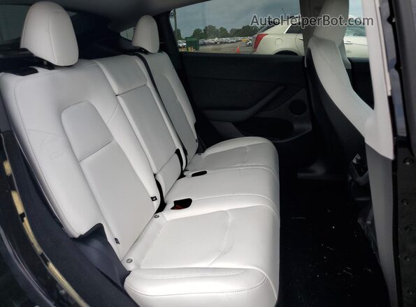 7SAYGDED9SF236493 2025 TESLA MODEL Black Вид задніх сидінь