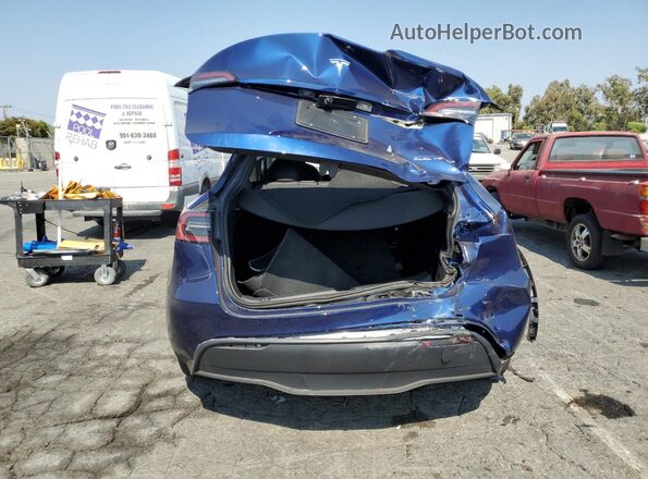 7SAYGDEE7SF276144 2025 TESLA MODEL Blue Vista trasera