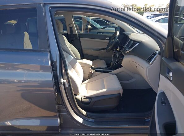 KM8J33A42JU626640 2018 HYUNDAI TUCSON Gray წინა სალონის ხედი