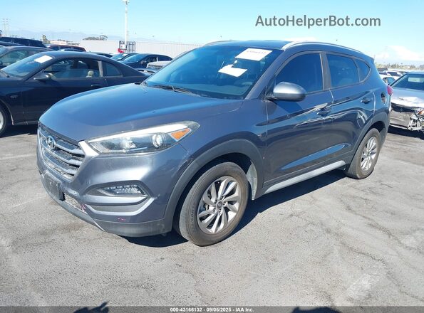 KM8J33A42JU626640 2018 HYUNDAI TUCSON Gray წინა მარცხენა ხედი სამი მეოთხედიდან