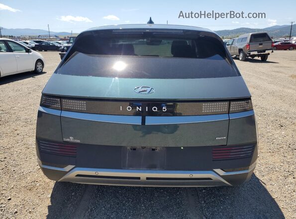 KM8KNDAF1PU201389 2023 HYUNDAI IONIQ Бирюзовый Вид сзади