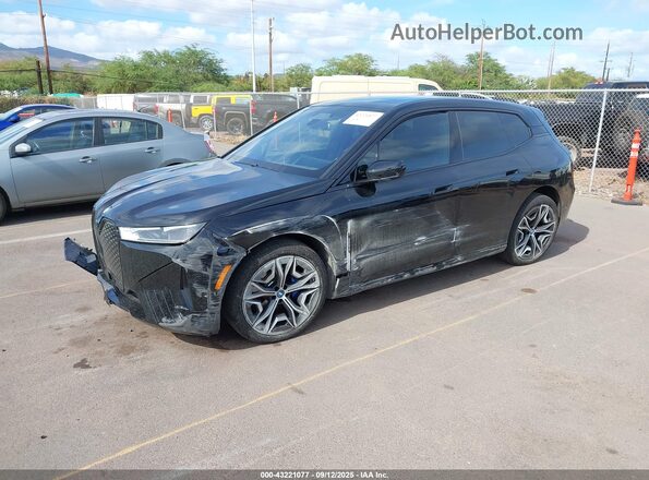 WB523CF07RCN39005 2024 BMW IX Black Vista tres cuartos delantera izquierda