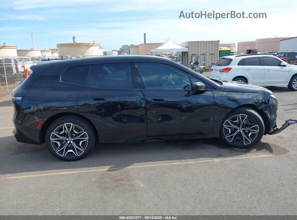 WB523CF07RCN39005 2024 BMW IX Black Vista interior trasera