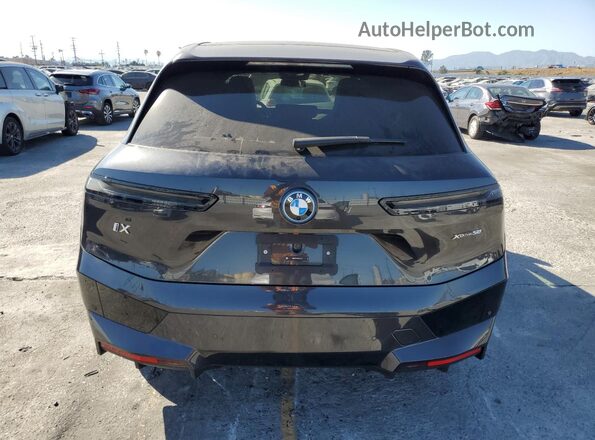 WB523CF09SCT23131 2025 BMW IX Charcoal Widok z tyłu