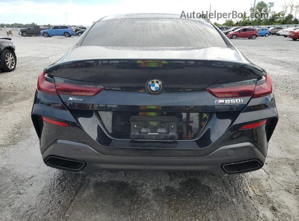 WBAGV8C02PCL57423 2023 BMW M8 Black Vista trasera