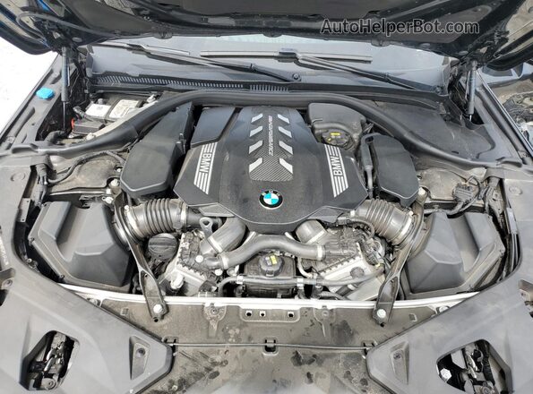 WBAGV8C02PCL57423 2023 BMW M8 Black Vista interior trasera
