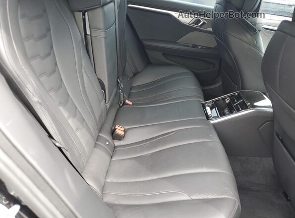 WBAGV8C02PCL57423 2023 BMW M8 Black Vista de los asientos traseros