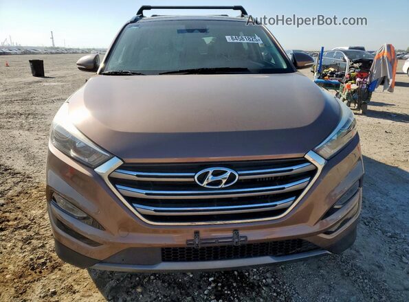 KM8J3CA27GU029538 2016 HYUNDAI TUCSON Коричневый Вид сзади