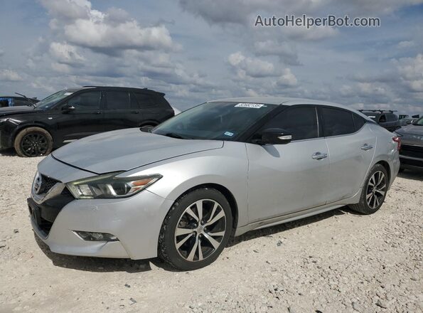 1N4AA6AP6JC380418 2018 NISSAN MAXIMA Серебряный Передняя левая четверть