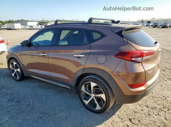 KM8J3CA27GU029538 2016 HYUNDAI TUCSON Коричневый Задняя правая четверть