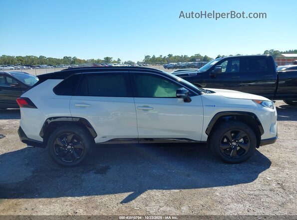 2T3E6RFV2MW016147 2021 TOYOTA RAV4 HYBRID White Вид задньої частини салону