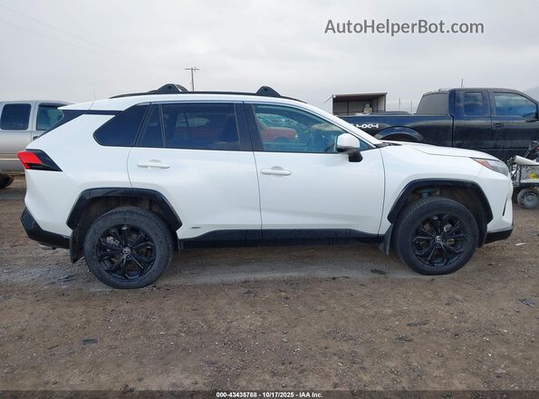 2T3T6RFV7NW029906 2022 TOYOTA RAV4 HYBRID White Widok wnętrza z tyłu