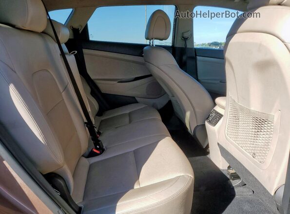 KM8J3CA27GU029538 2016 HYUNDAI TUCSON Коричневый Вид задней части салона