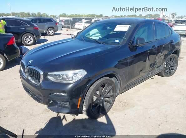 5UX2V1C04L9C56655 2020 BMW X4 Black Vista tres cuartos delantera izquierda