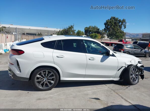 5UX33EX01S9Z70024 2025 BMW X6 Белый Вид задней части салона